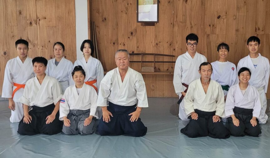 A Group of People in Japanese Apperals Sitting Down