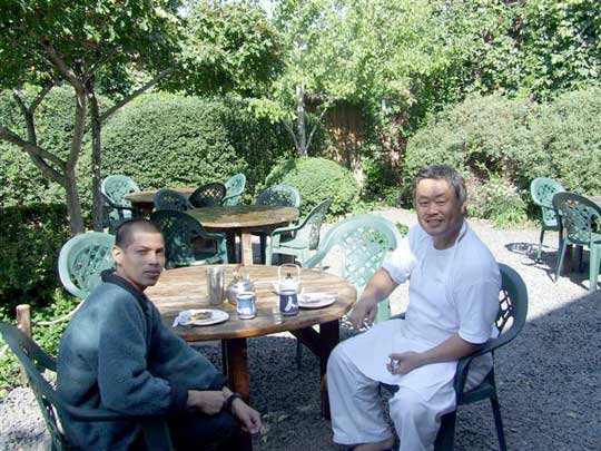 Armando and Homma Kancho sharing a moment in the garden.