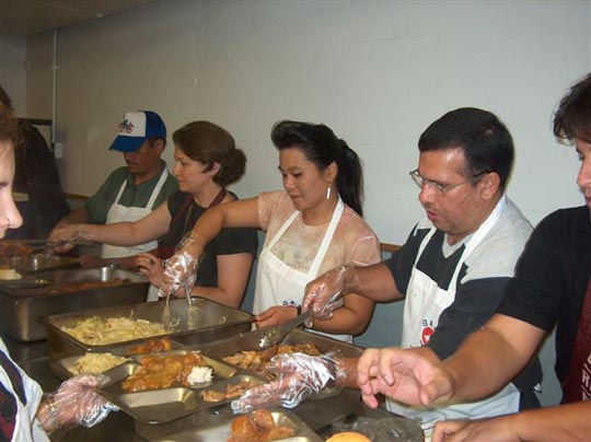 Stephanie Yap Sensei serving dinner at the mission.