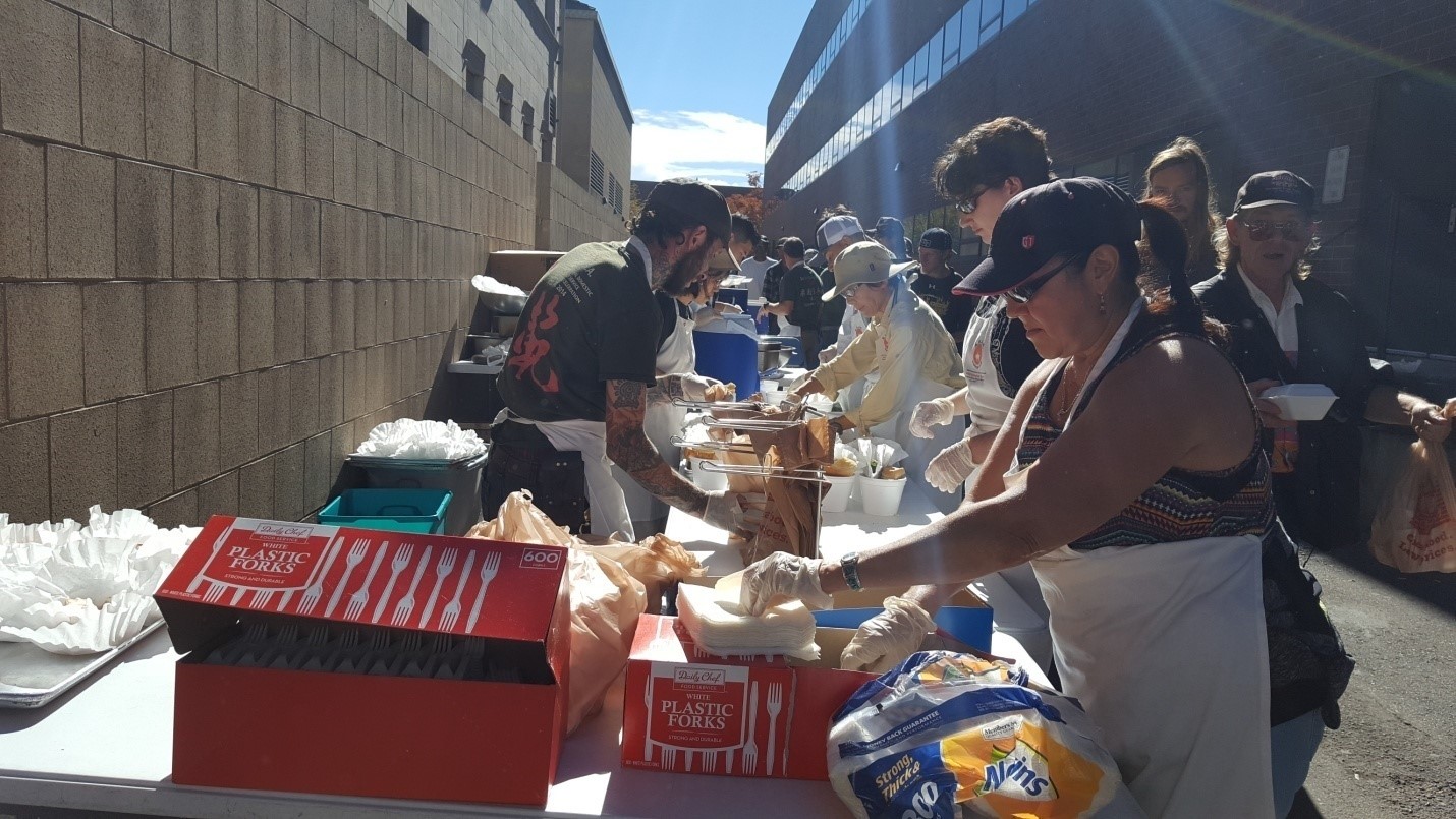 Denver City Councilwoman Debbie Ortega and Nippon Kan volunteer serving meals for those in need in Denver.